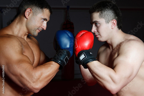 Two boxers in training in the gym © andrii kornev