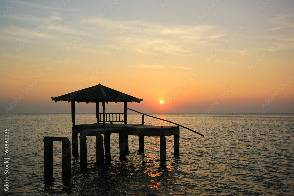Silhouette of old pavilion in the sea