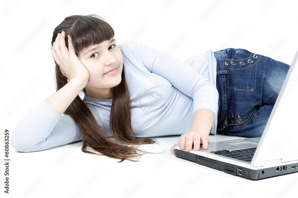 Teen girl learns lessons on an isolated white background Teen girl learns lessons on an isolated white background