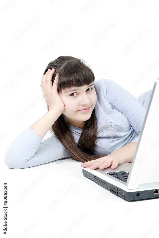 Teen girl learns lessons on an isolated white background Teen girl learns lessons on an isolated white background