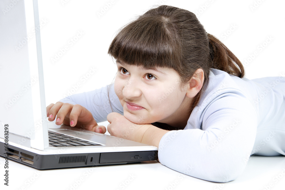Teen girl learns lessons on an isolated white background Teen girl learns lessons on an isolated white background