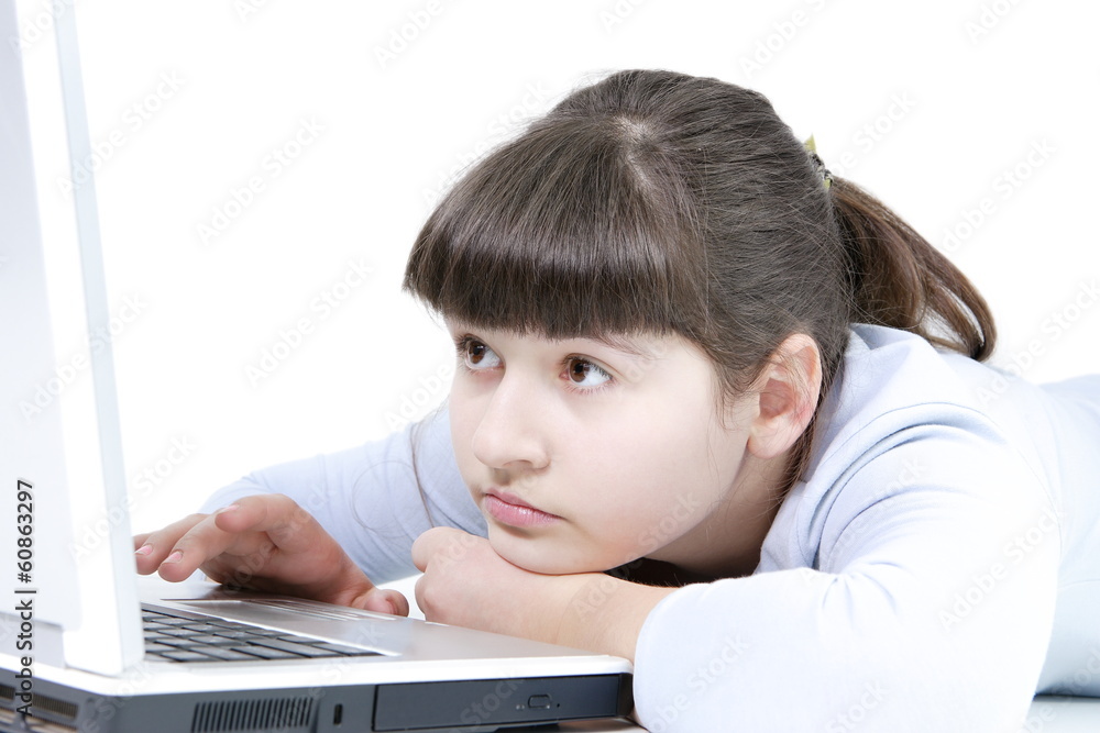 Teen girl learns lessons on an isolated white background Teen girl learns lessons on an isolated white background