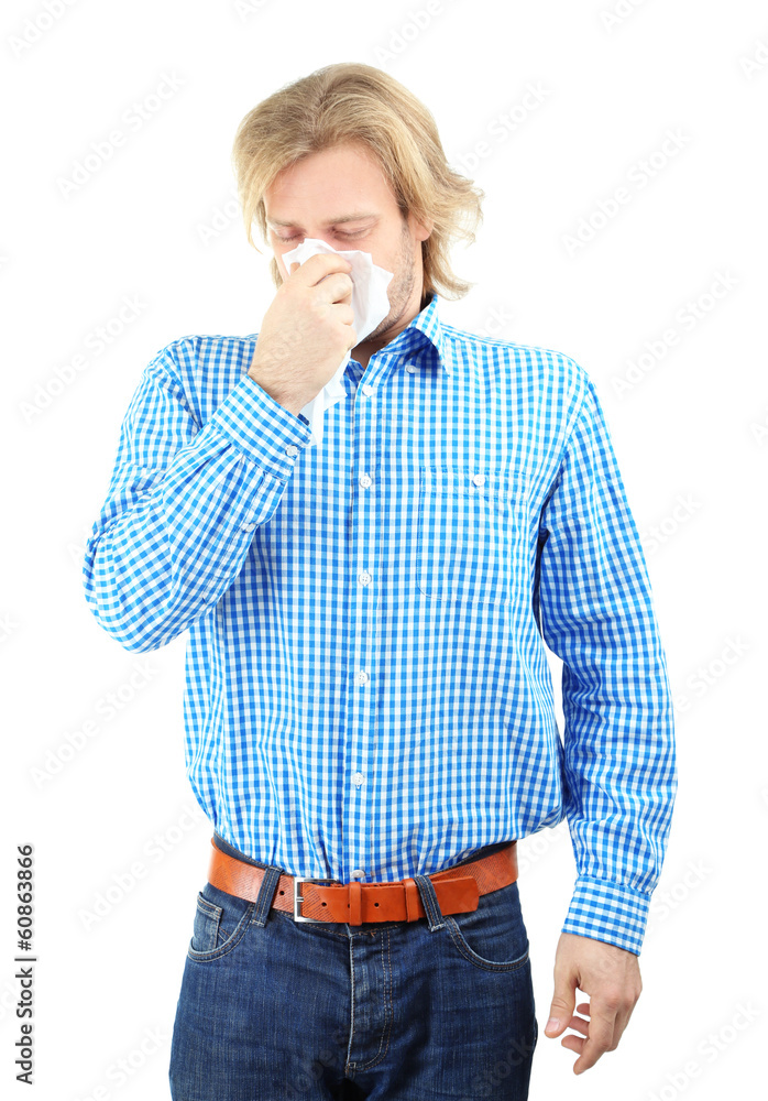 Sneezing young man isolated on white Sneezing young man isolated on white