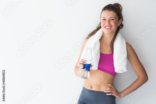 Young woman with towel and water bottle © WavebreakmediaMicro
