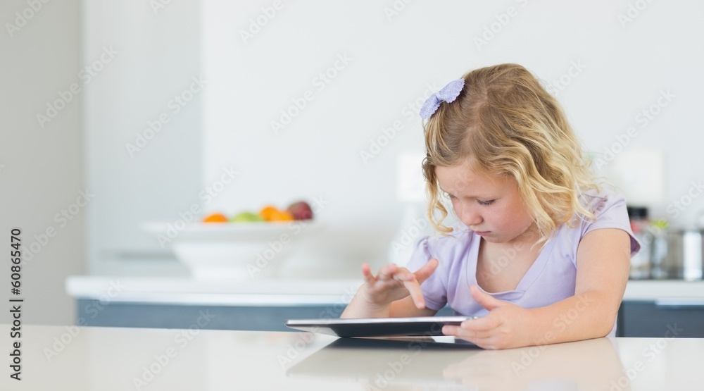 Girl touching digital tablet at table Girl touching digital tablet at table