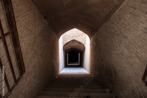Entrance to an a underground aqueduct in Yazd, Iran © Matyas Rehak