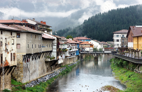 Orozko village in Basque Country with river and a bridge photo