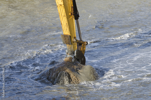 Dredging harbor with excavator