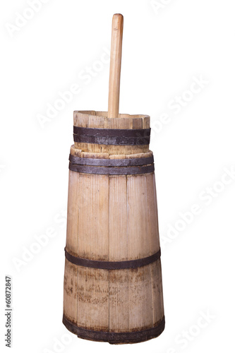 old butter churn isolated on a white background