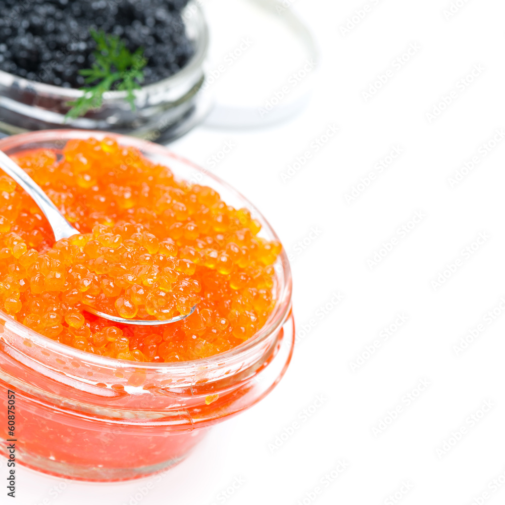 spoon of red caviar in a glass jar, close-up, isolated spoon of red caviar in a glass jar, close-up, isolated