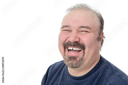 Close-up portrait of a funny mature man laughing