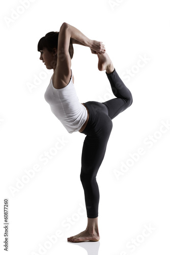 sport girl doing yoga stretching exercise, studio shot in silhou