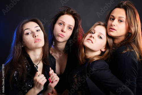 fashionable attractive party young women, over black