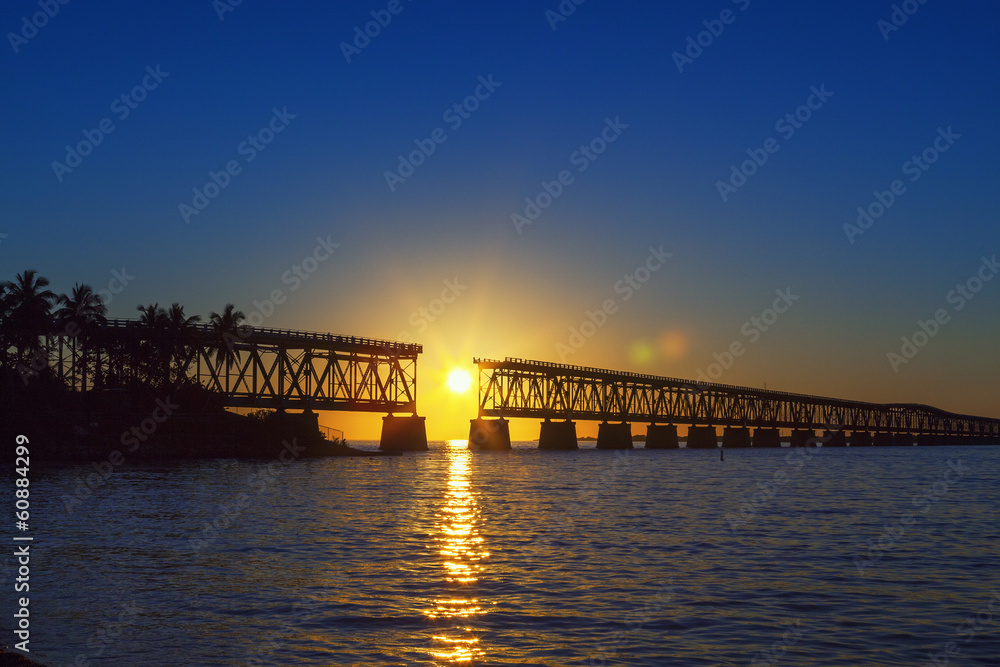 colorful sunset with broken bridge