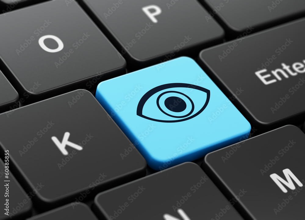 Privacy concept: Eye on computer keyboard background Privacy concept: Eye on computer keyboard background