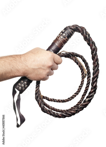 male hand holding brown leather whip isolated on white backgroun