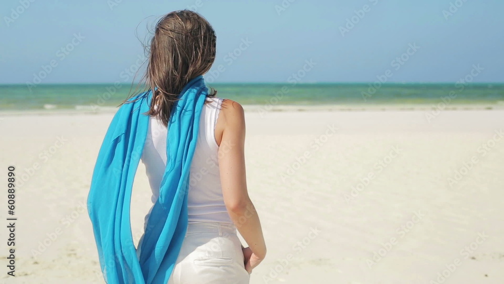 Young beautiful woman standing on beautiful exotic beach Young beautiful woman standing on beautiful exotic beach