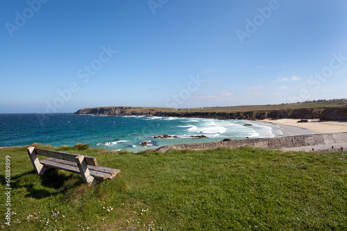 Empty bench overlooking a scottish atlantic beach