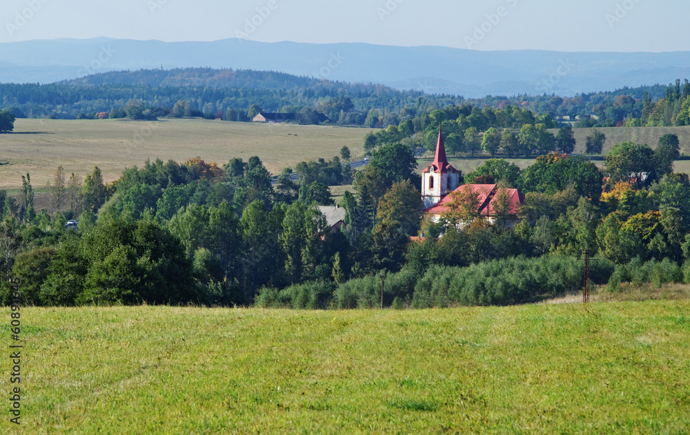 Autumn rural landscape with village church