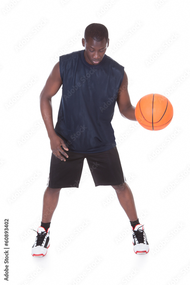 African Young Man Playing Basketball