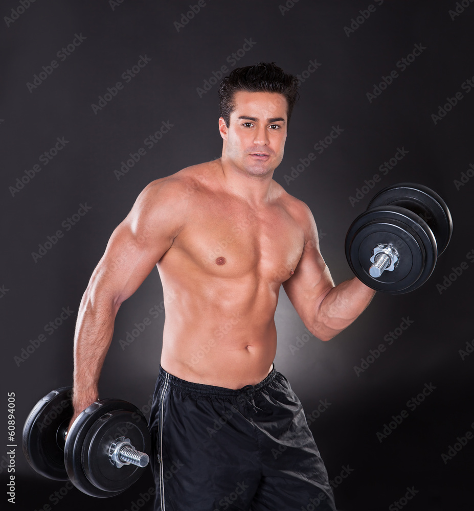 Man Lifting Dumbbells