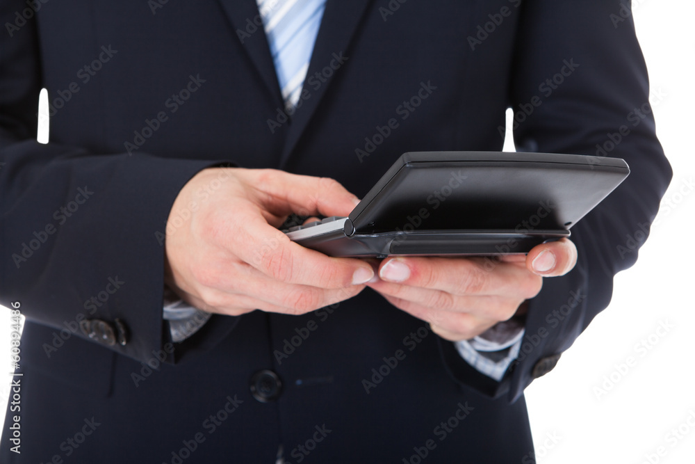 Businessman Using Calculator Businessman Using Calculator