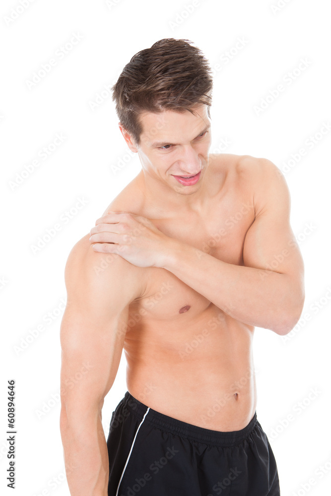 Young Man Suffering From Shoulder Pain Young Man Suffering From Shoulder Pain