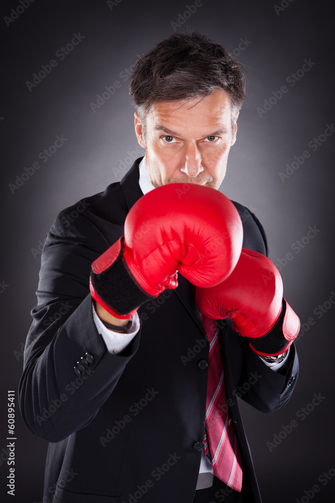 Businessman In Red Boxing Gloves