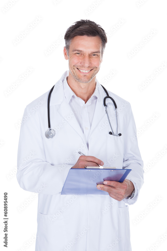 Male Doctor Writing On Clipboard Male Doctor Writing On Clipboard