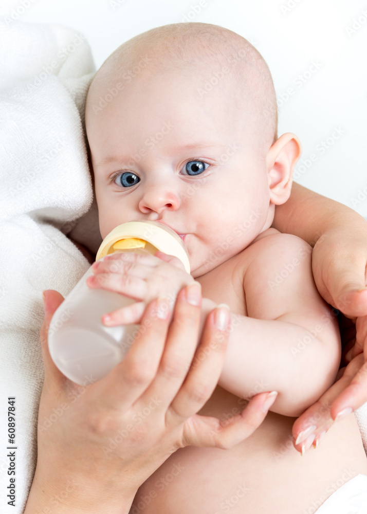 mom feeding by milk her baby infant from bottle mom feeding by milk her baby infant from bottle