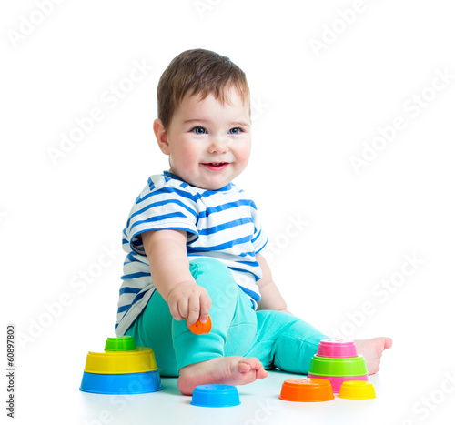smiling baby playing with t...