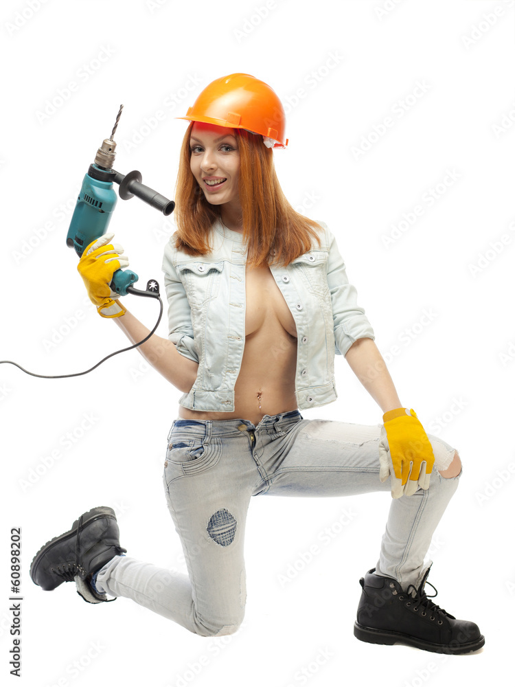 Girl with large breasts with an electric drill. Girl with large breasts with an electric drill.