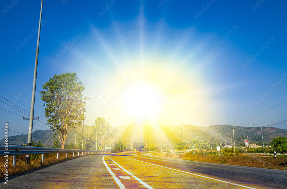 Country road asphalt to success and happy sun light Country road asphalt to success and happy sun light