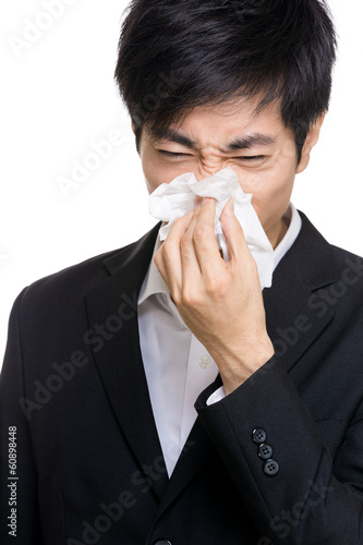 Asian businessman sneezes portrait
