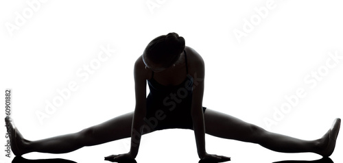 young woman ballerina ballet dancer stretching warming up  silho photo