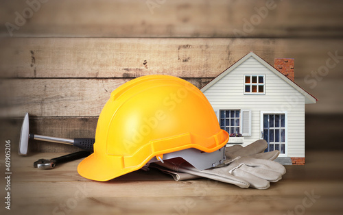 Yellow hardhat and leather gloves