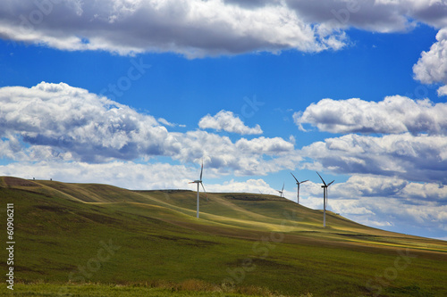 Tableau sur toile Wind turbines on a hill