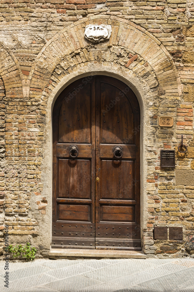 Closed door of a building in the medieval town of San Gimignano
