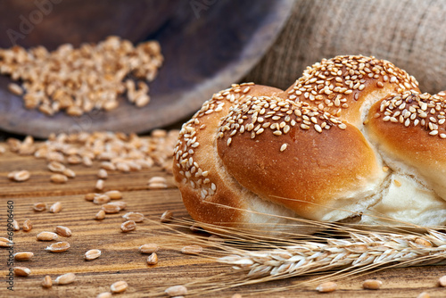 Crunchy fresh bun isolated on the old wooden table