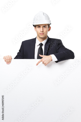 Businessman in white headpiece pointing hand gestures