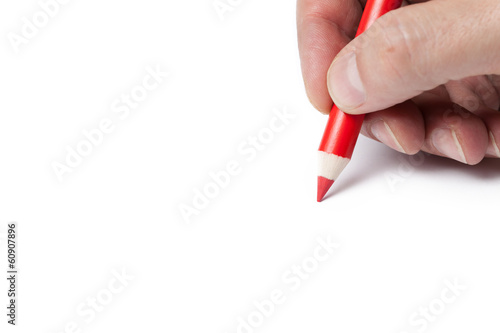 ręka trzyma ołówek