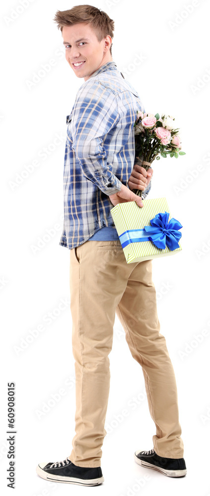 Handsome young man with flowers and gift, isolated on white Handsome young man with flowers and gift, isolated on white