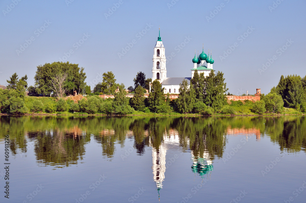 cathedral with bell tower and his reflection in water