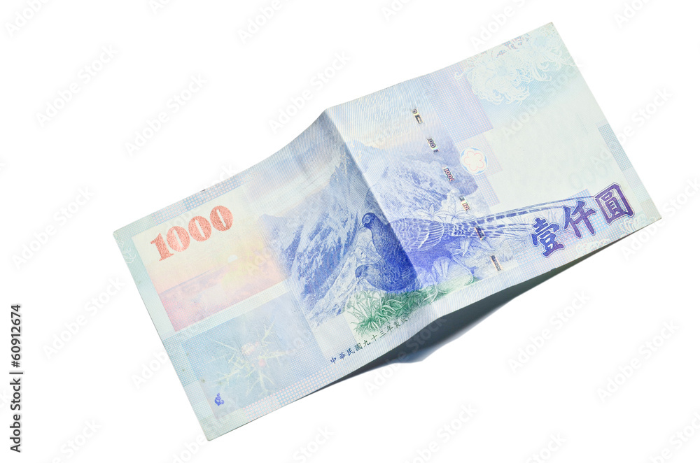 A 1000 New Taiwan Dollars bill on white background
