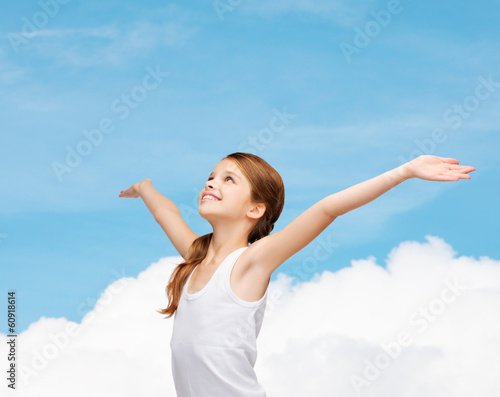 smiling teenage girl with raised hands