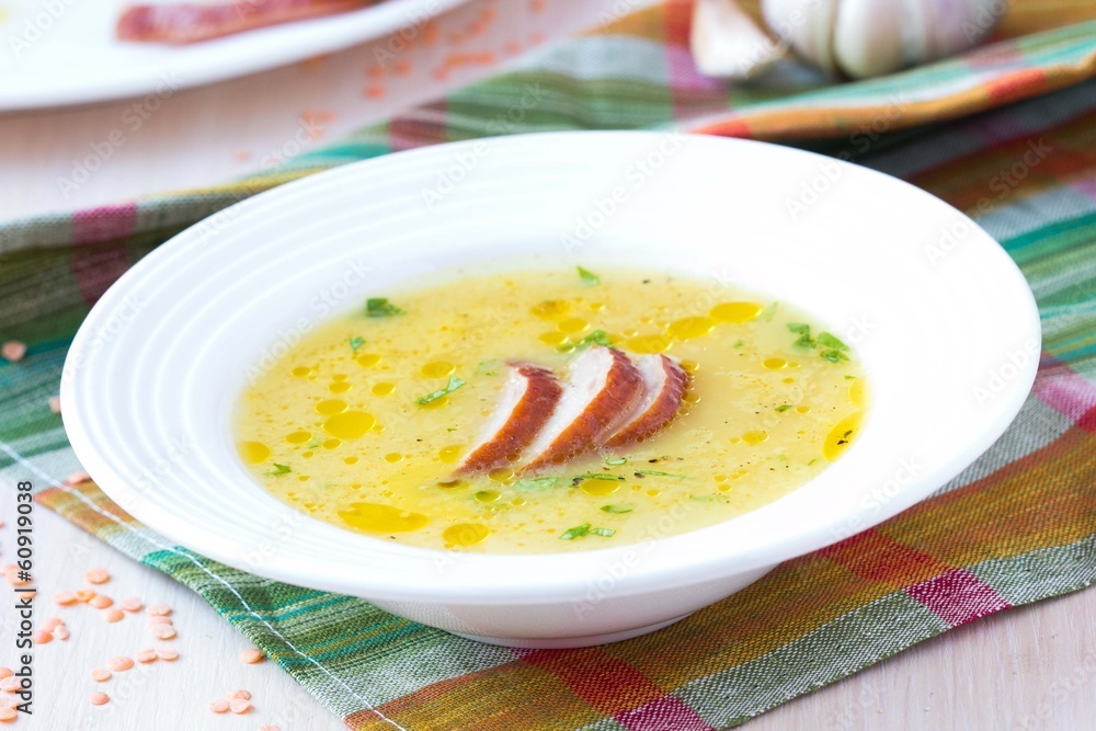 Cream soup of red lentil with smoked meat, duck, chicken
