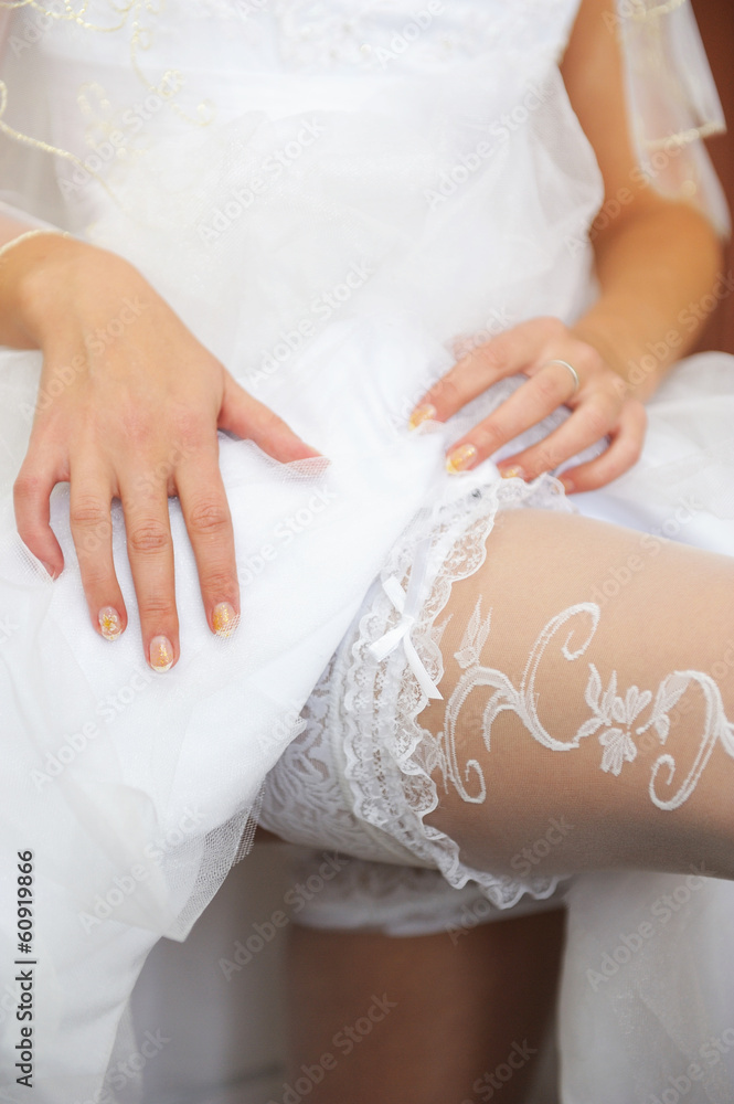 Bride corrects garter Bride corrects garter
