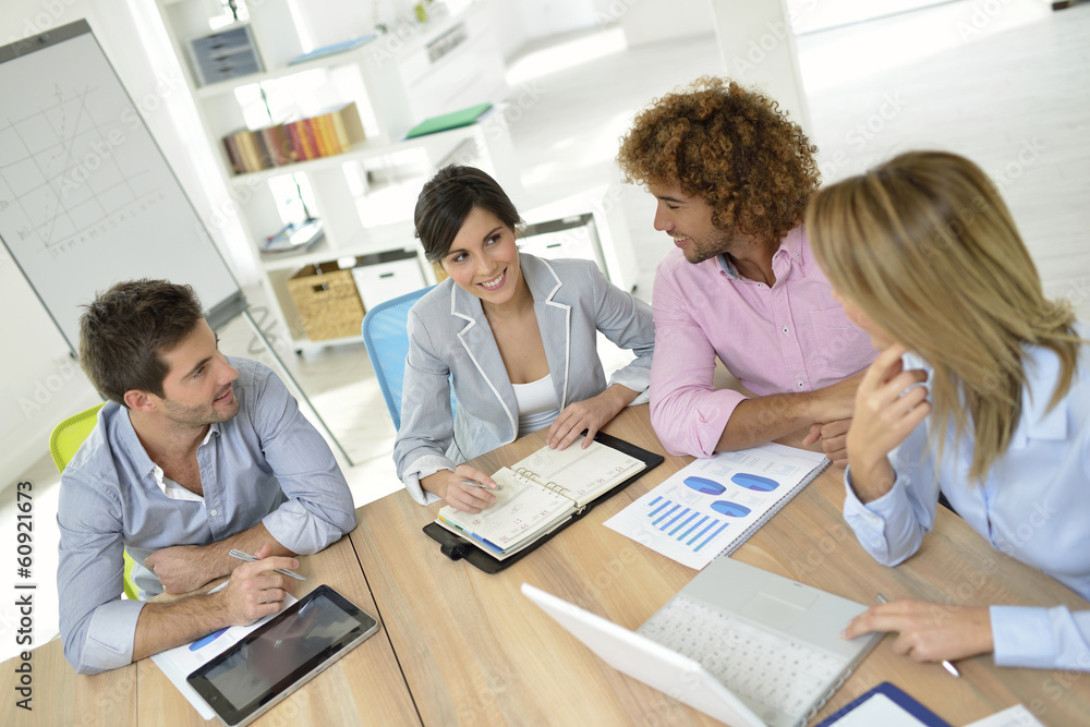 Business people meeting around table