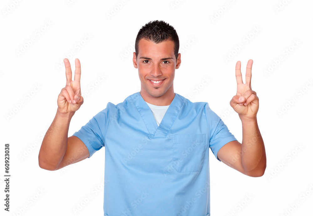 Happy nurse man smiling with winning sign Happy nurse man smiling with winning sign