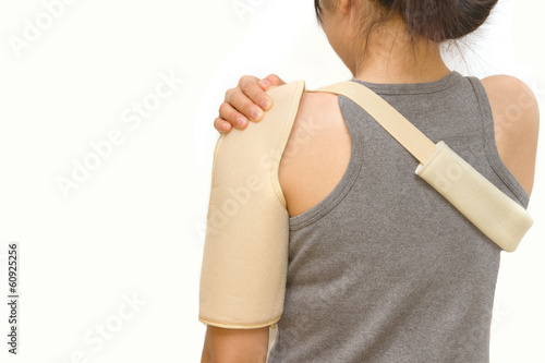 Fotografi woman wearing a shoulder brace
